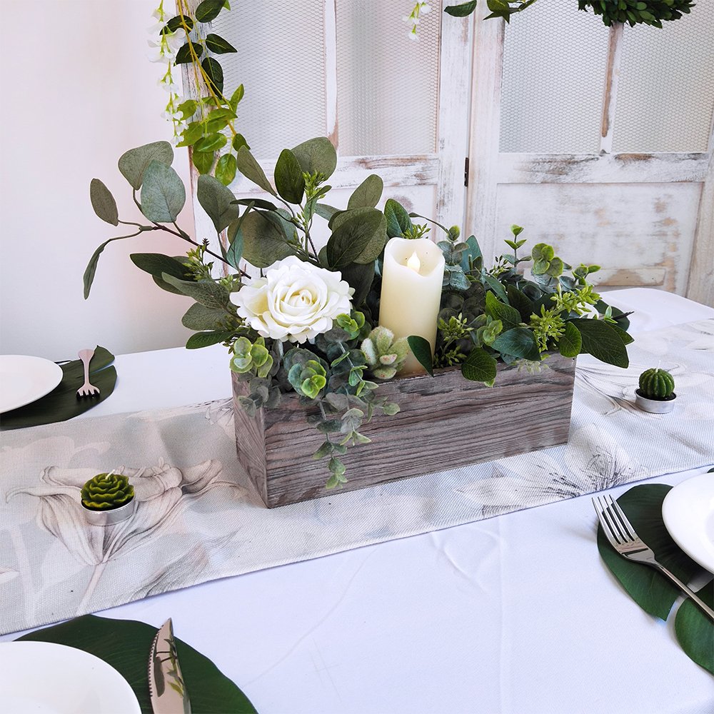 Windiy planter box filled with succulents or air plants creates a low maintenance focal point.