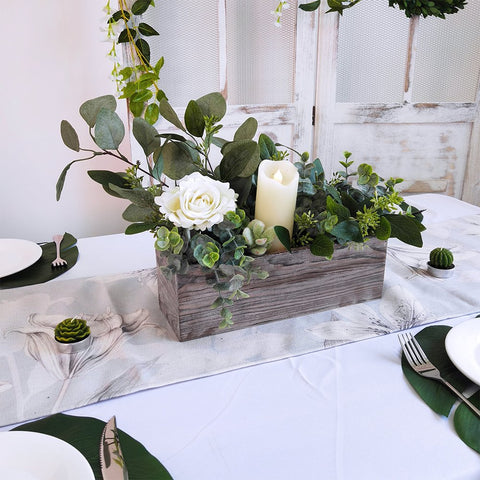 Windiy planter box filled with succulents or air plants creates a low maintenance focal point.