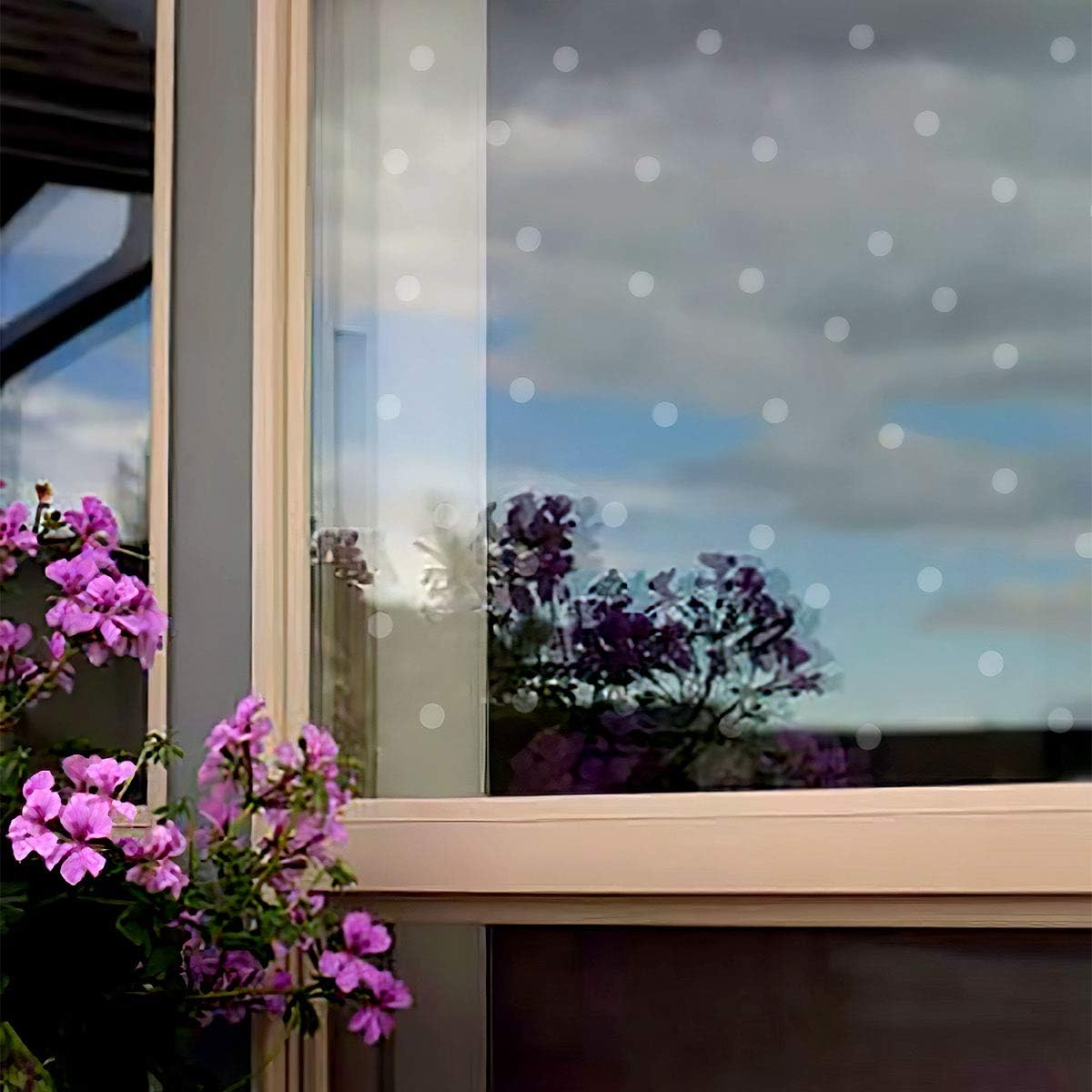 Dried UV dots on glass appear clear while acting as a deterrent.