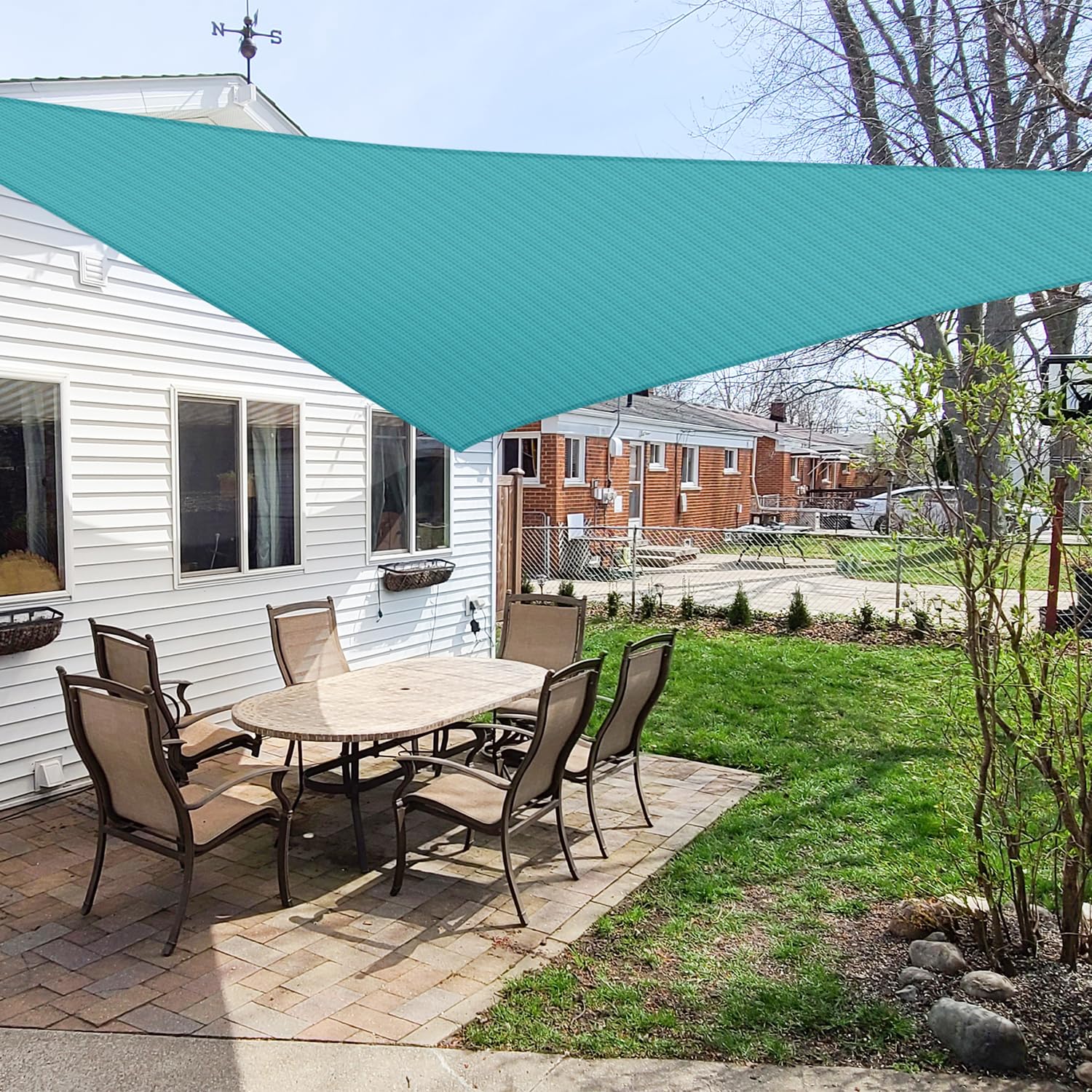 Windscreen4less sun shade triangle turquoise over patio provides cooling outdoor shade