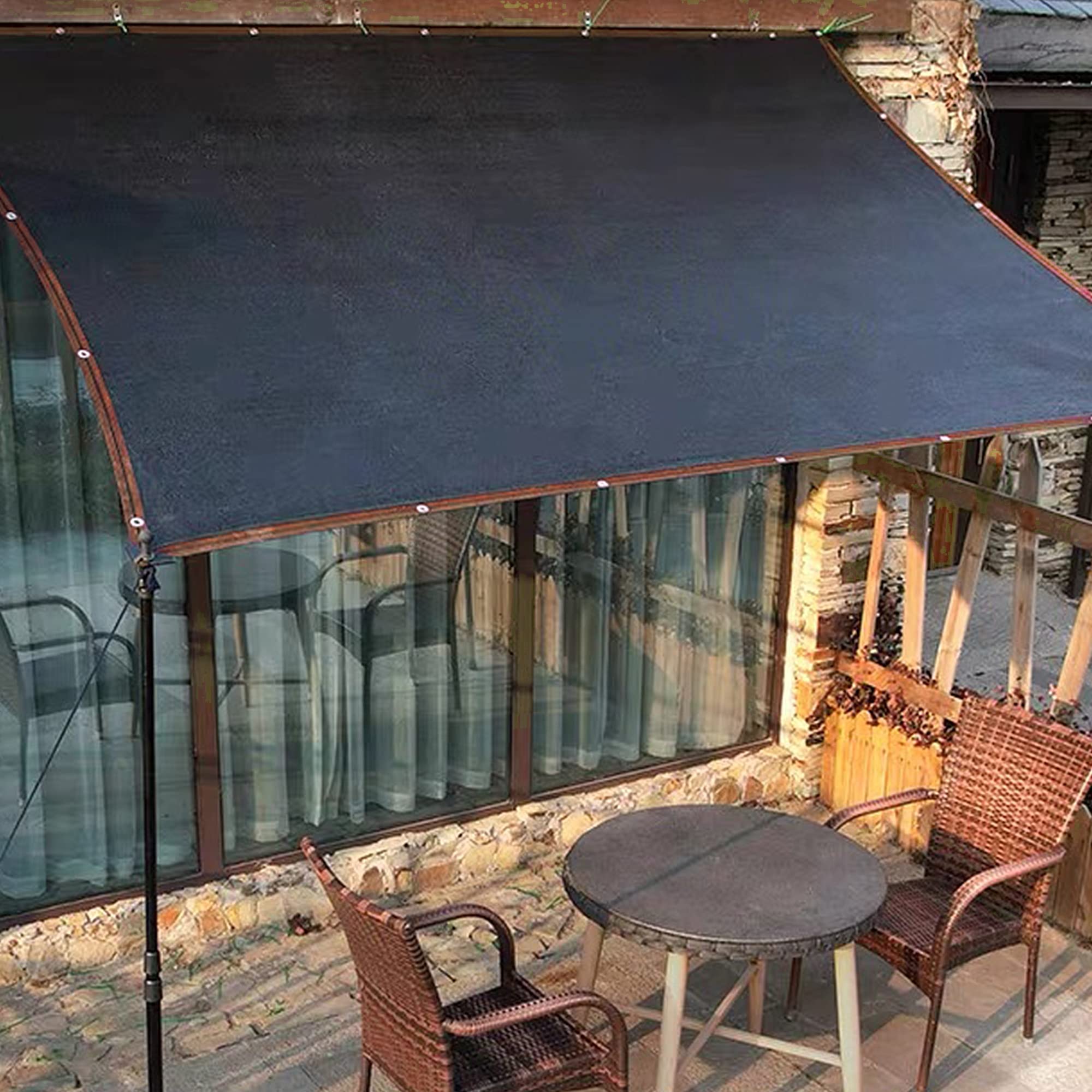 Outdoor shade tarp protects patios and kennels from direct sun.
