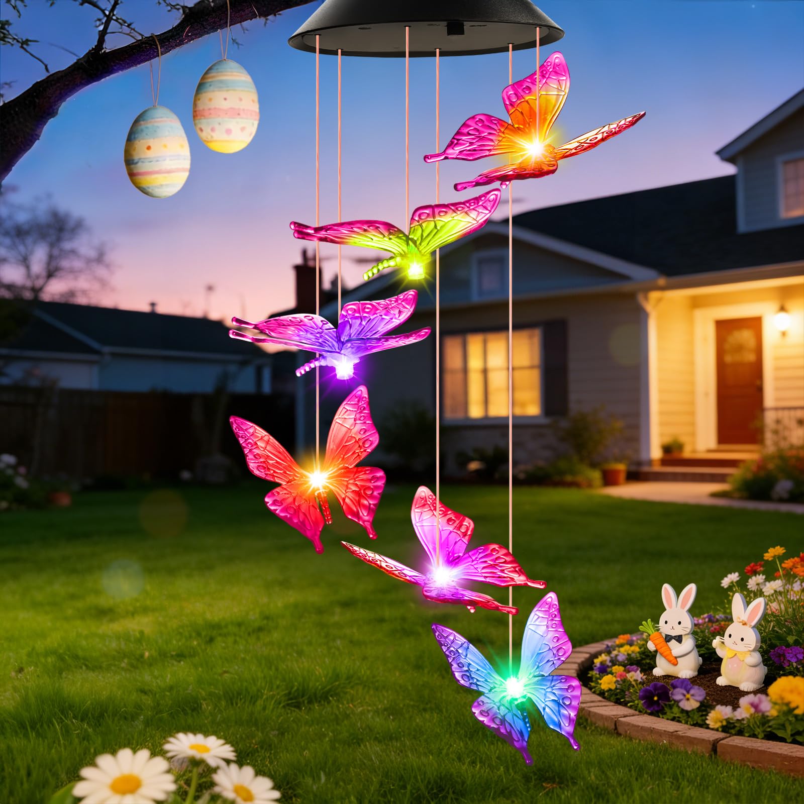 Winzwon solar butterfly wind chime lights outdoors at dusk for a charming garden glow.