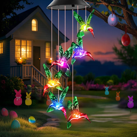 Winzwon solar hummingbird wind chime glows in garden at dusk for enchanting ambience.