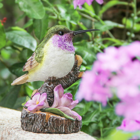 Wiresusan garden figurine near flower bed adds charming yard accent.