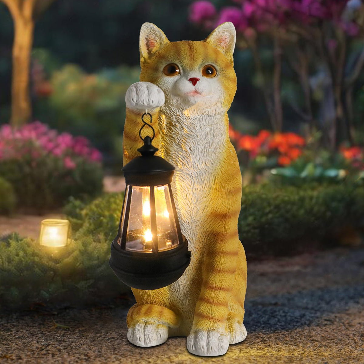 Wonder Garden solar cat statue with lantern lights outdoor spaces at night.