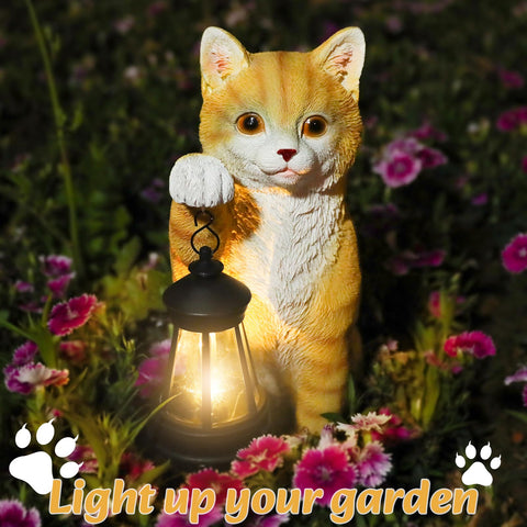 Solar charging cat statue powers a warm glow after sun exposure.