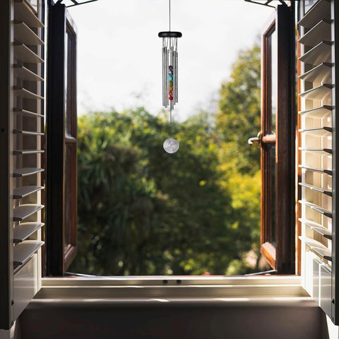 Woodstock Chimes Chakra Seven Stones wooden base in outdoor garden setting for soothing tones