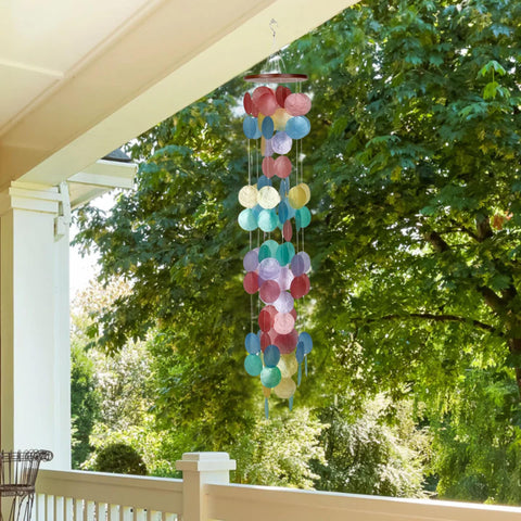 Woodstock Chimes Rainbow capiz shells create luminous glow for garden decor.