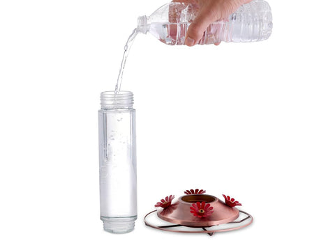Woodstream Birdscapes elegant copper-glass feeder highlights four flower ports for multiple hummingbirds.