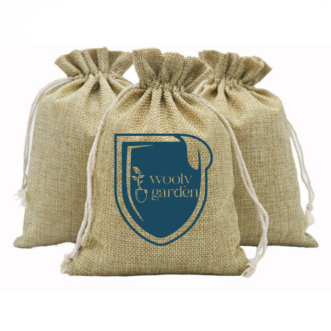 Wooly Garden wool pellet fertilizer in a 2lb bag for garden use and soil improvement.