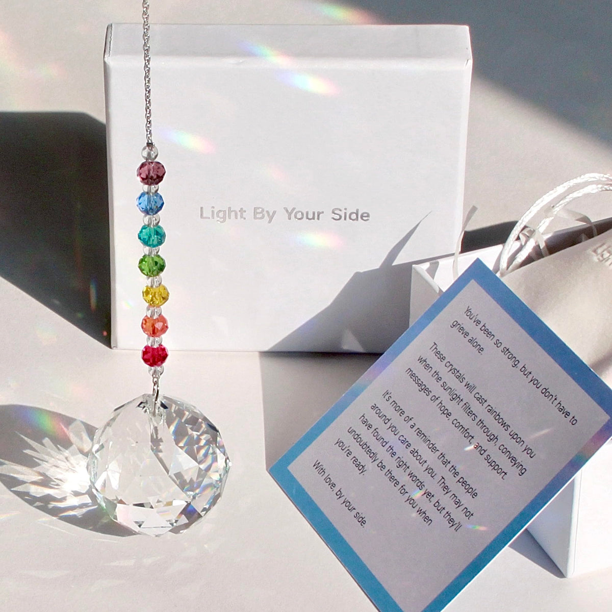 WOOWA Light by Your Side crystal suncatcher catching sunlight to create rainbows for comfort