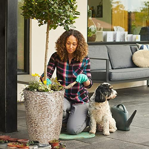 Worth 9-Gallon Tall Planter lightweight stone-look material for easy handling.
