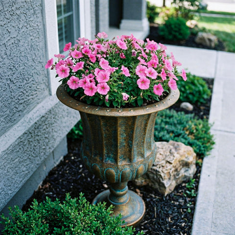 Worth Garden urn planters on front porch with classic styling.