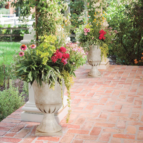 Worth Garden urn planter beige close-up of the drainage hole and plug for easy water management.