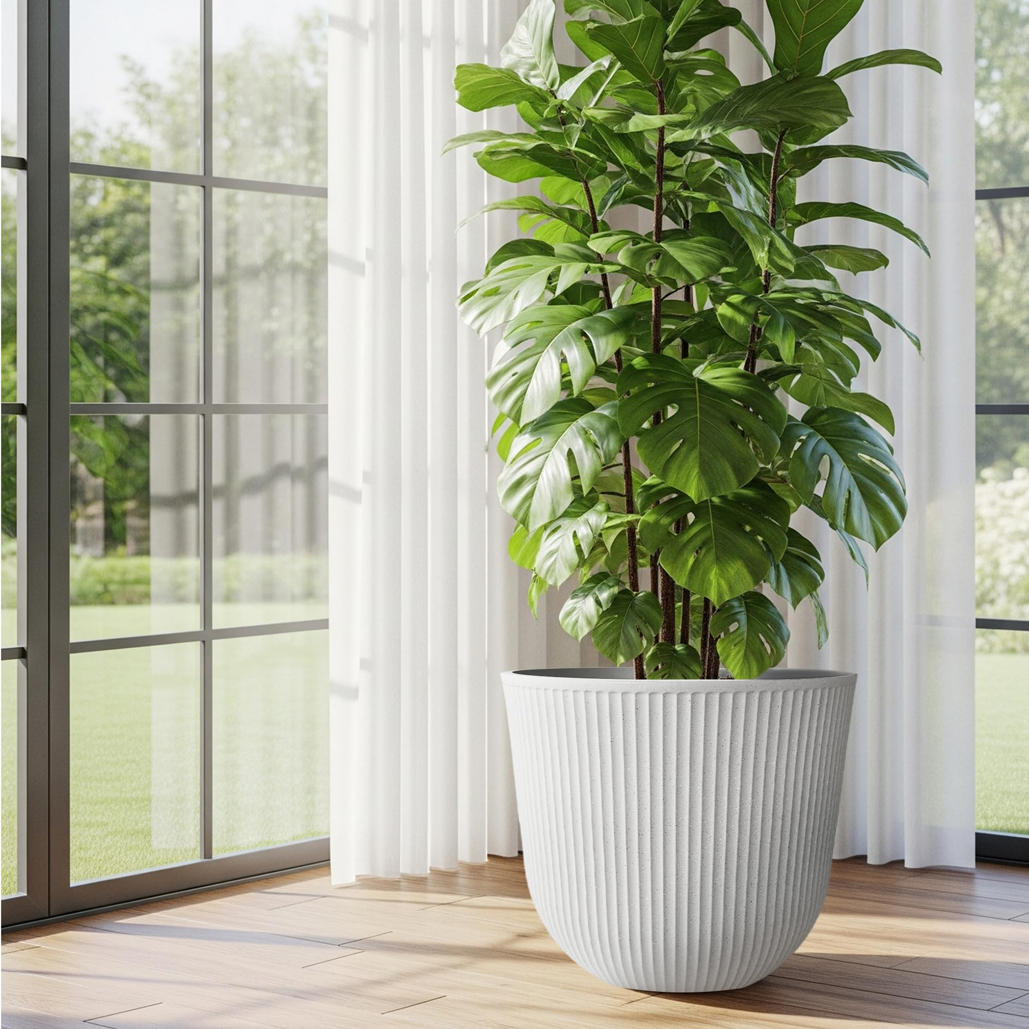 Worth round planters paired with greenery for stylish indoor living room decor.