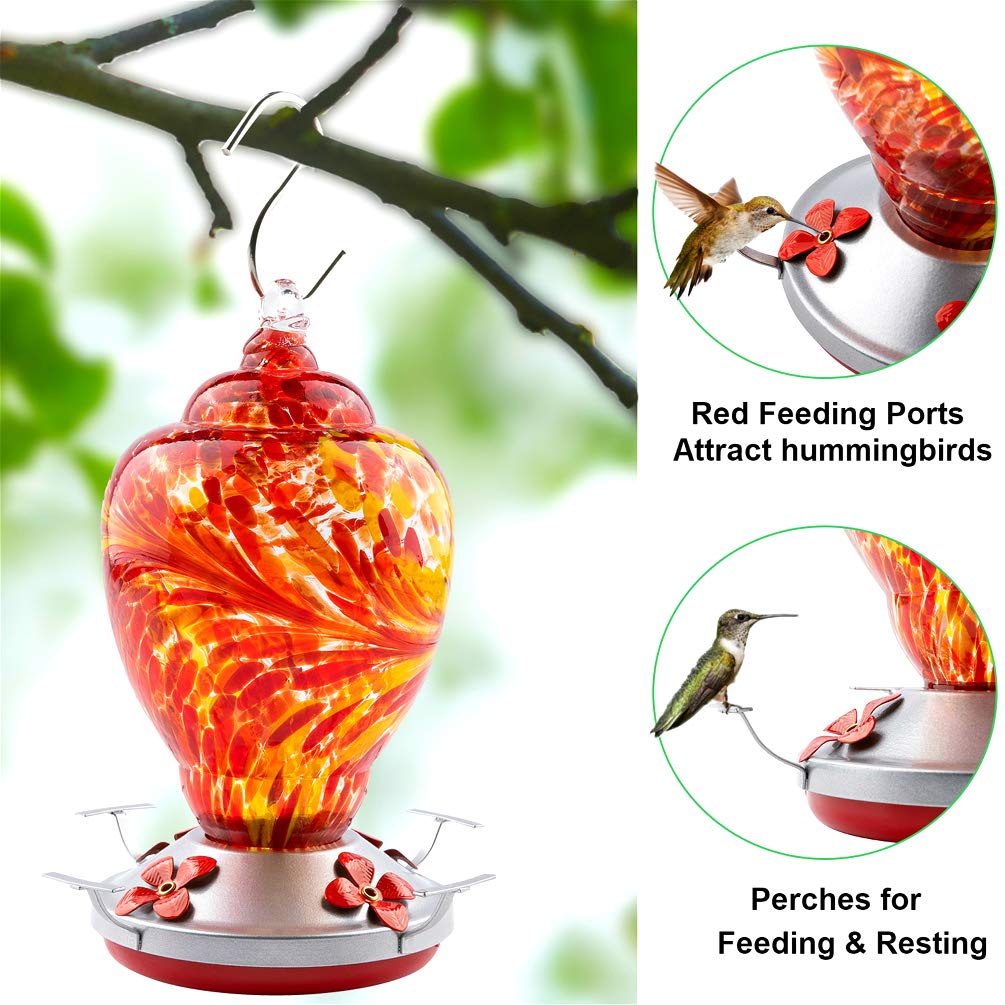 WOSIBO red hummingbird feeder hanging on an outdoor hook in a patio.