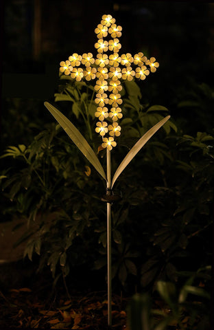 WSgift weather resistant cross stake standing tall among greenery