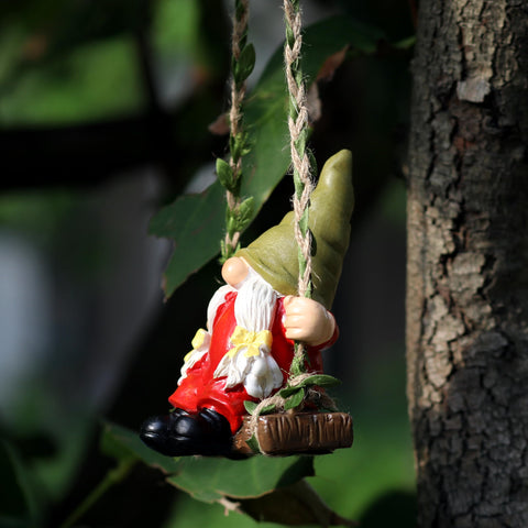 WSHMZYHOME gnome on swing in yard adds classic garden character.