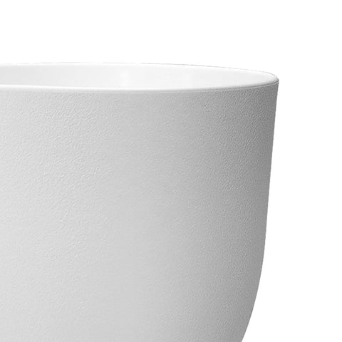 WSMKSZ close-up of drainage holes in white pot