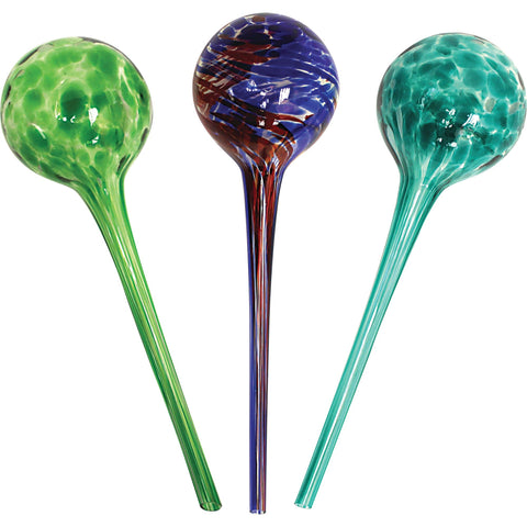 Wyndham House colorful hand-blown glass watering globe keeps indoor plants hydrated while away