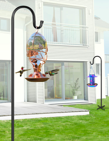 XDW-GIFTS solar lanterns hanging from hooks along a garden path