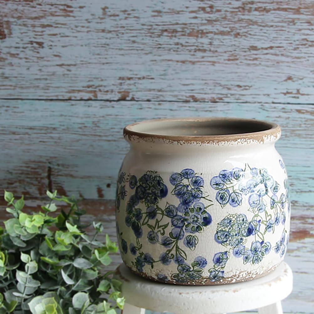 Xiaan Jiaju deep blue floral planter detail showcases craftsmanship.