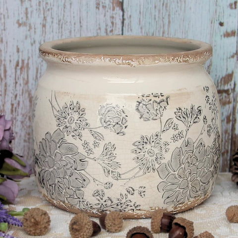 Xiaan Jiaju distressed glaze planter complements vintage-inspired room decor