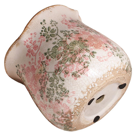 Xiaan Jiaju Pastel Meadow planter complements bright foliage.