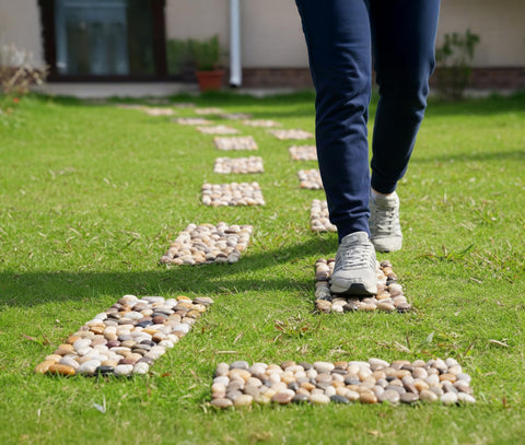 Xindian river rock stepping mats define mulch paths for a serene walkway.