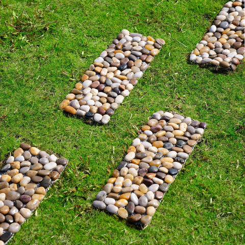 Xindian river rock stepping mats provide a non-slip surface beside outdoor showers.
