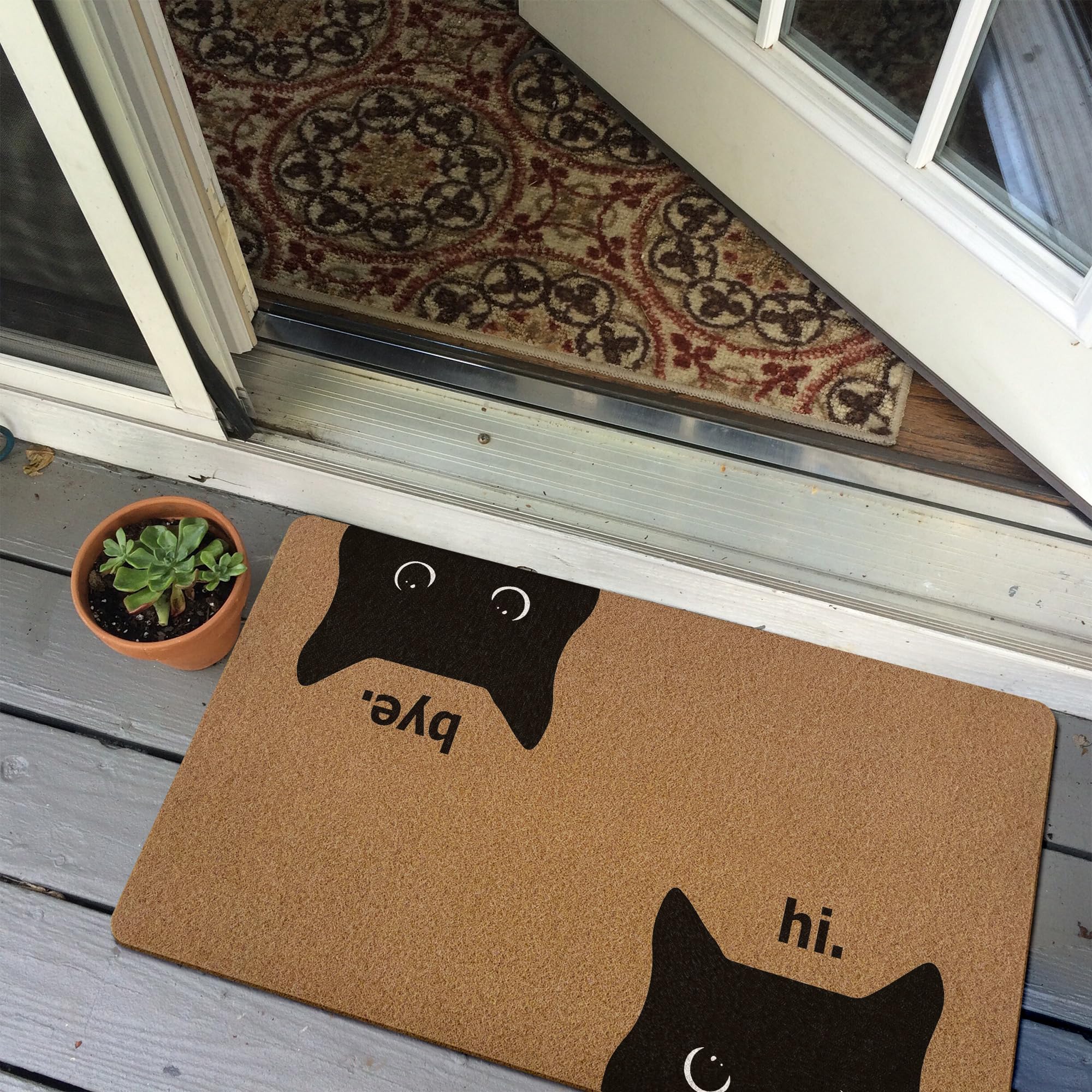 XLDLIOO Indoor-outdoor rug with rubber backing stays in place.