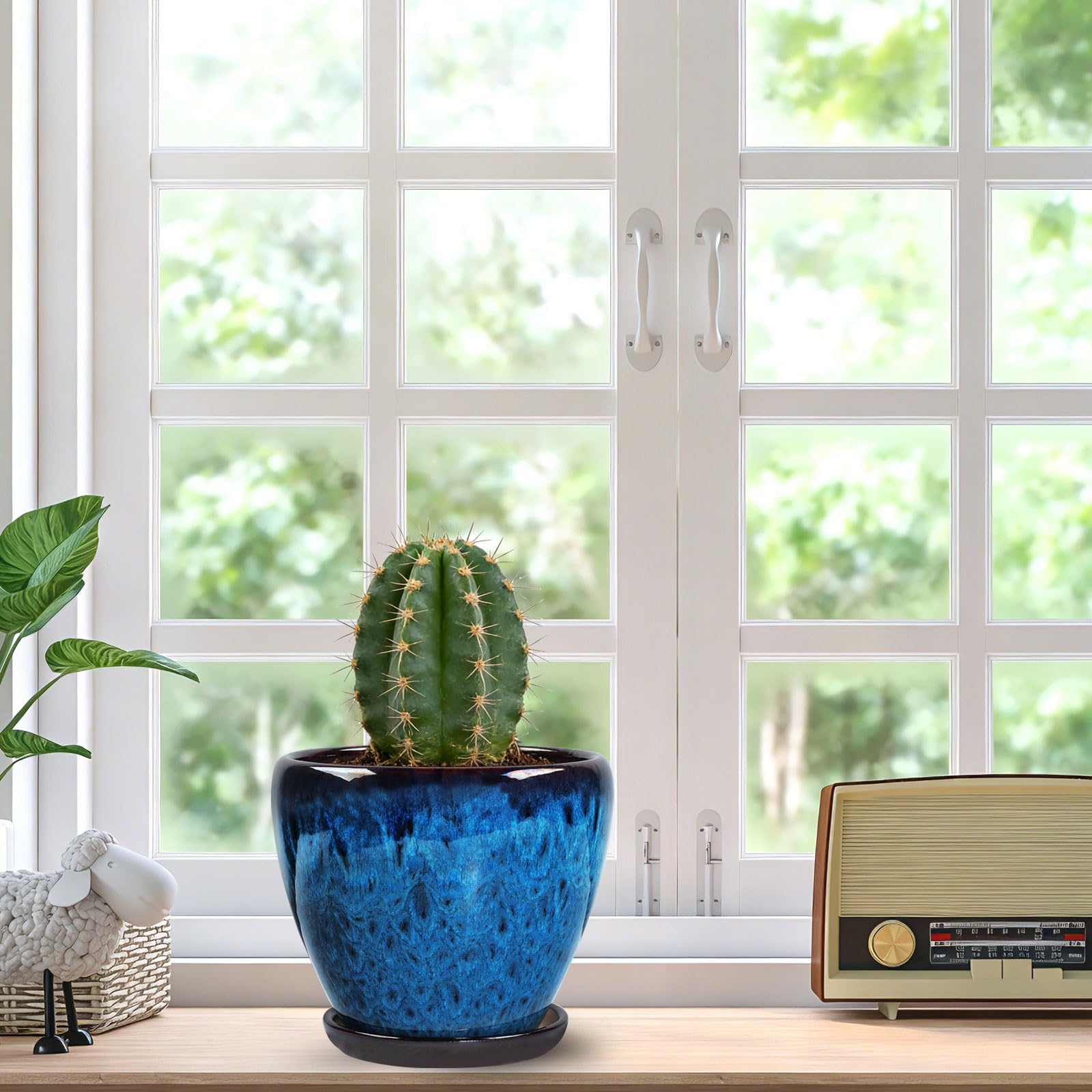 Xoogifae peacock blue glazed ceramic pot highlighting decorative texture
