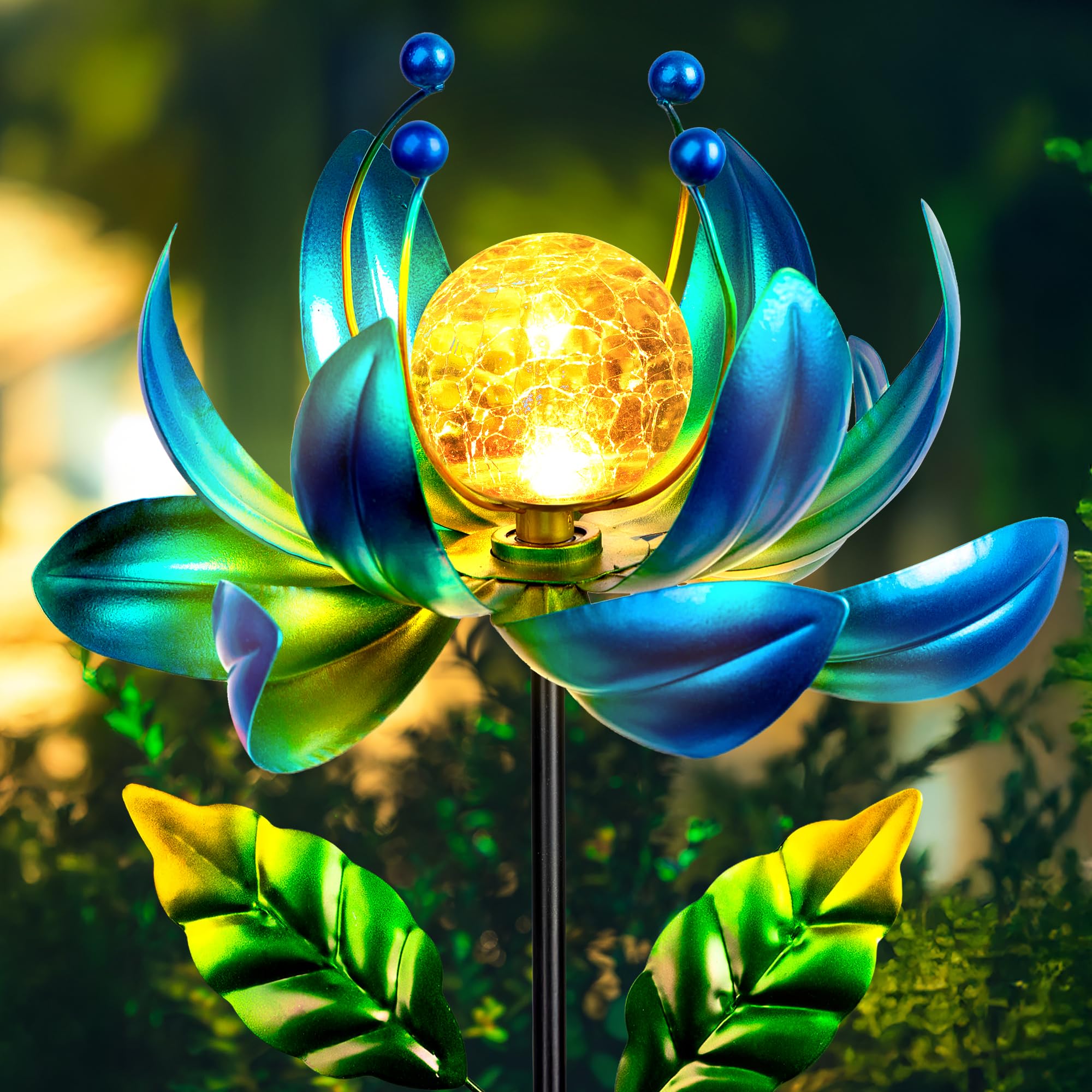 XPSCOCO Solar Wind Spinner close-up of crackle glass globe illuminating a garden at night