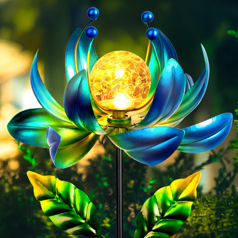 XPSCOCO Solar Wind Spinner close-up of crackle glass globe illuminating a garden at night