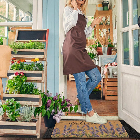 XuoAz lavender welcome doormat on a porch with non-slip backing for safety.