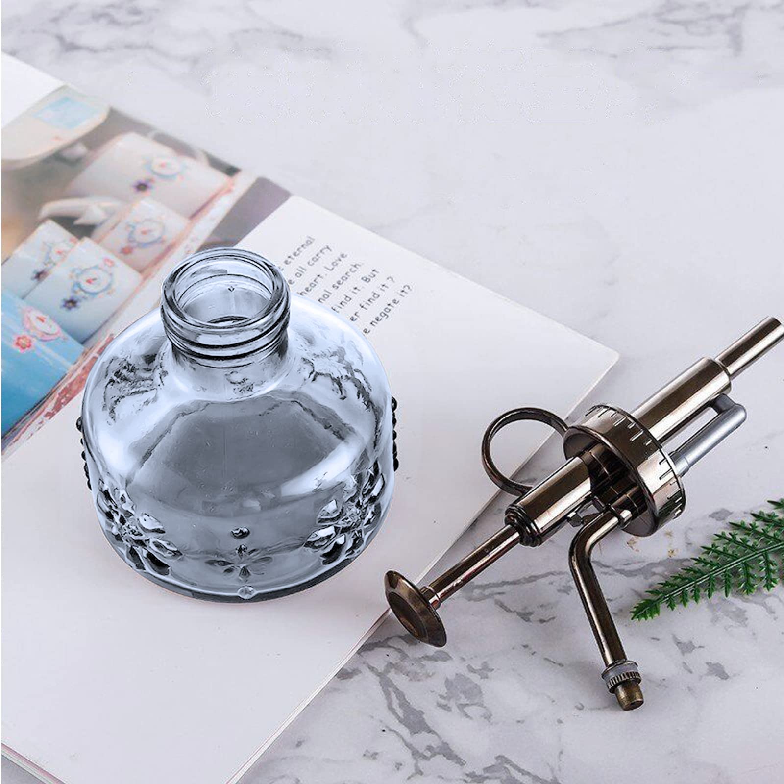 XXXFLOWER grey retro sprayer complements interiors while watering plants.