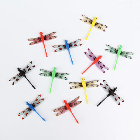 Xyntara indoor dragonfly clip decor on greenhouse plants and houseplants.