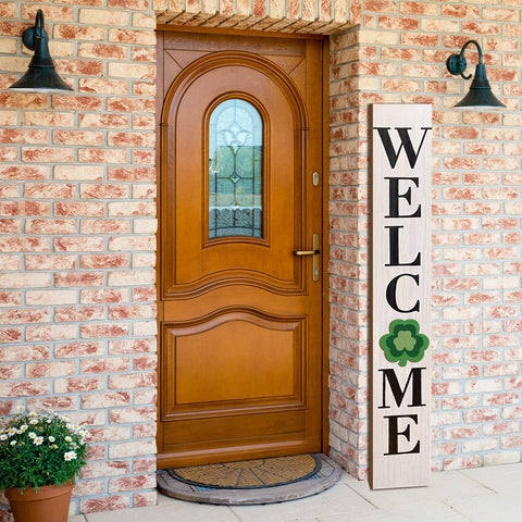 Yalikop welcome sign wood panel closeup highlighting craftsmanship.