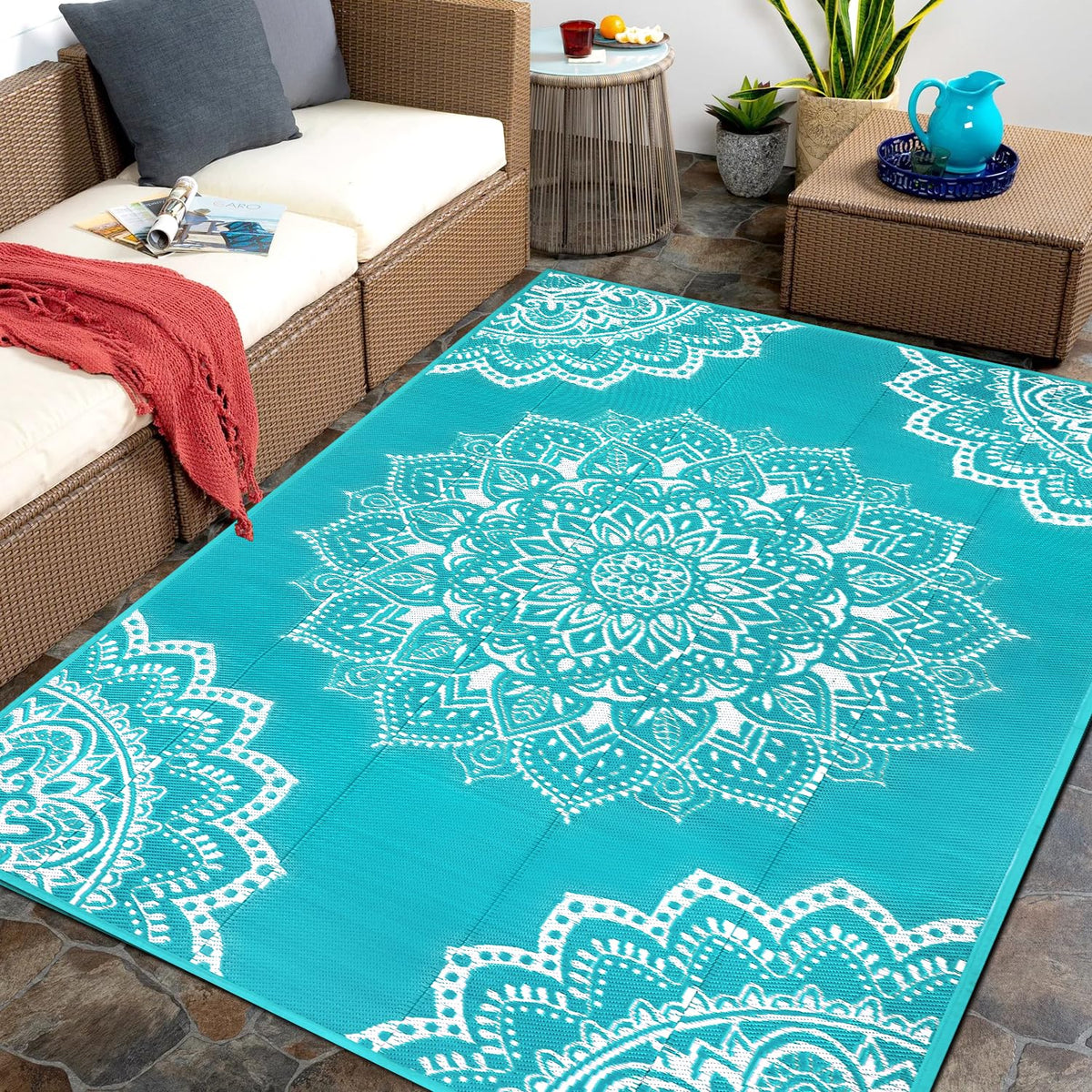 Yamaziot waterproof outdoor rug 5x8 blue on patio for durable outdoor comfort.