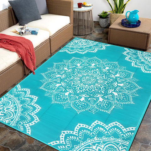Yamaziot waterproof outdoor rug 5x8 blue on patio for durable outdoor comfort.