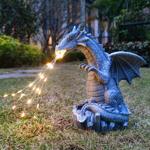 Yardancer dragon solar garden statue glows softly at dusk for charming outdoor ambiance.