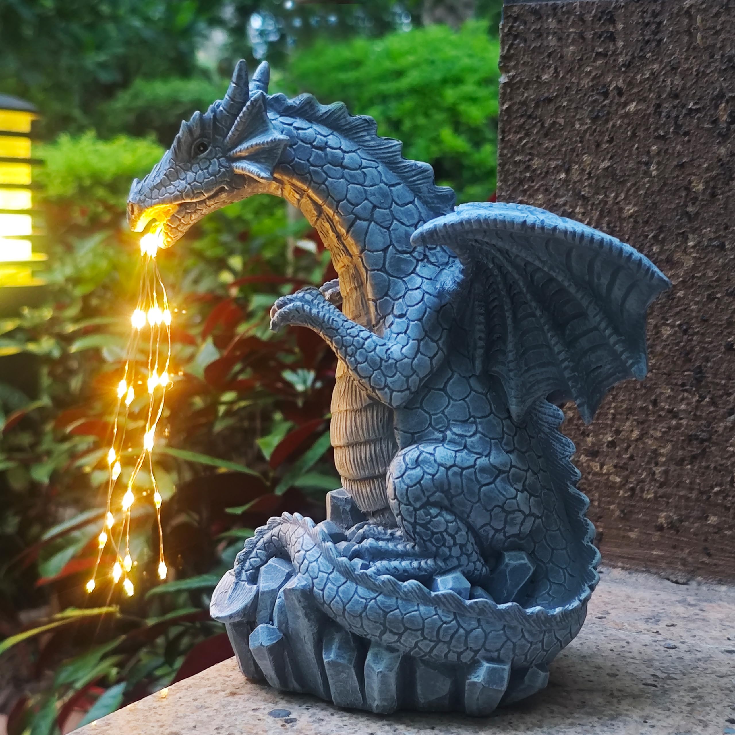 Yardancer dragon statue with LED lights enhances patios with magical night-time lighting.