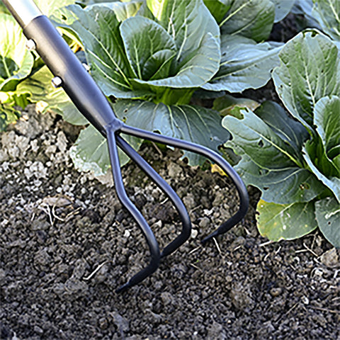 YEELOR adjustable-handle tiller enabling comfortable garden maintenance outdoors.
