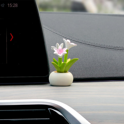 YGMONER lily flowerpot dashboard decor enhances car interior with a delicate resin bloom.