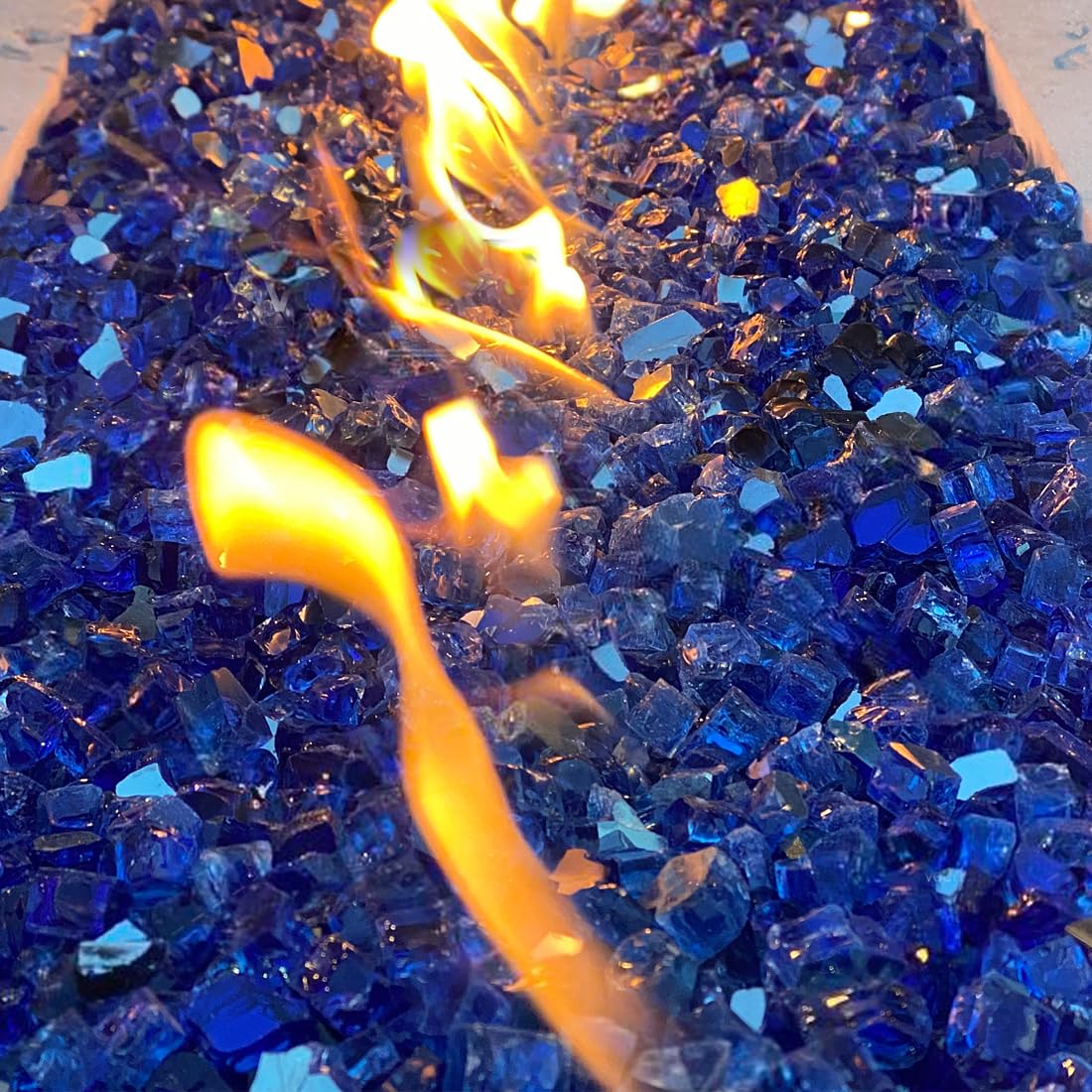 YISZM blue fire pit setup with glass rocks creating modern ambiance