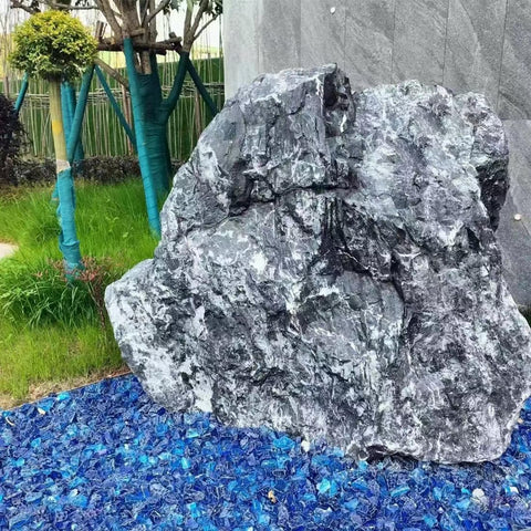 YISZM blue firetable display with reflective rocks and flames
