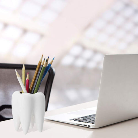 YOFIT teeth pot doubles as a desk organizer for clips and notes.