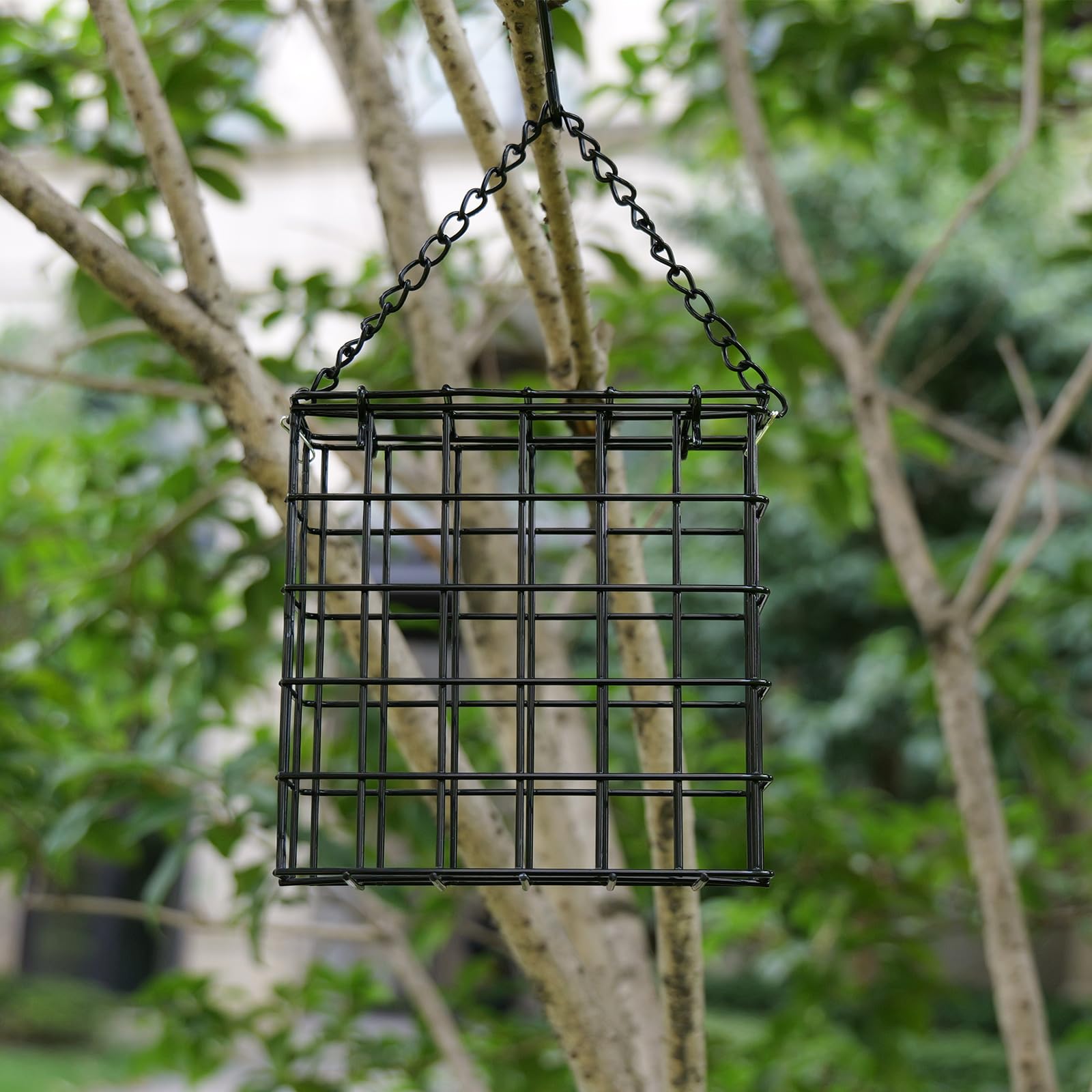 Yojanner hanging bird feeder in a lush garden, ideal for watching birds up close.