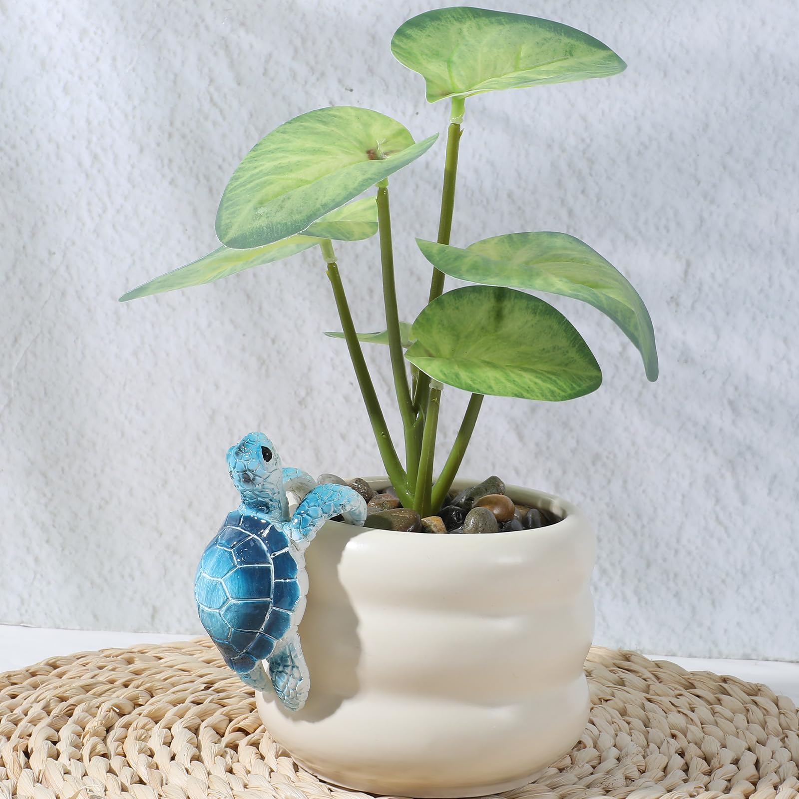 Yolev climbing tortoise figure decor brings personality to small plant displays.