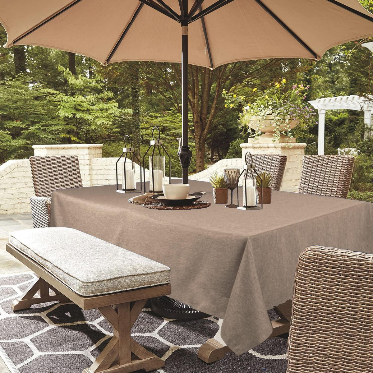 YoungSeahome outdoor tablecloth with umbrella hole protecting a patio table.